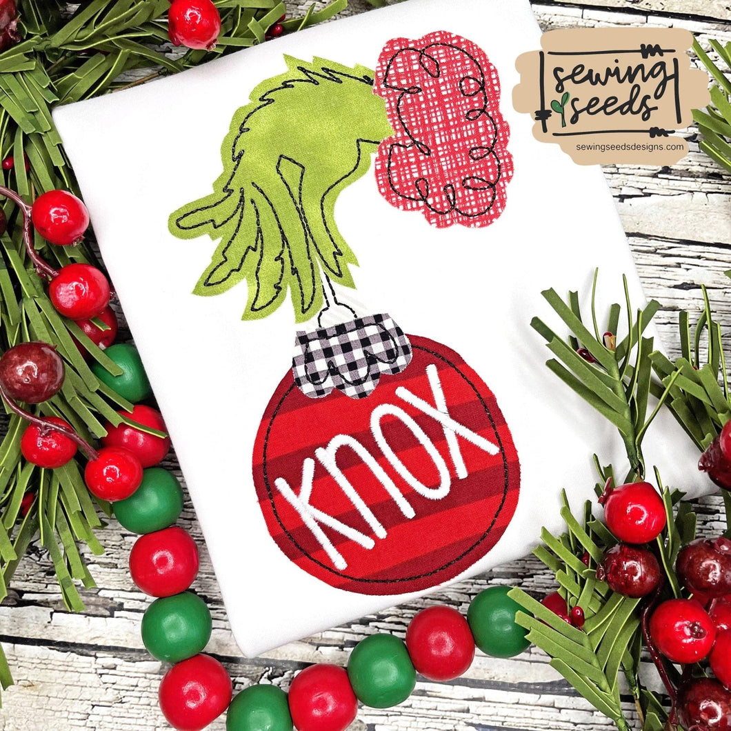 Grinch Hand with Ornament Applique SS - Sewing Seeds